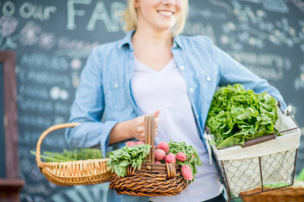 istock Woman Holding Vegetables 972576326