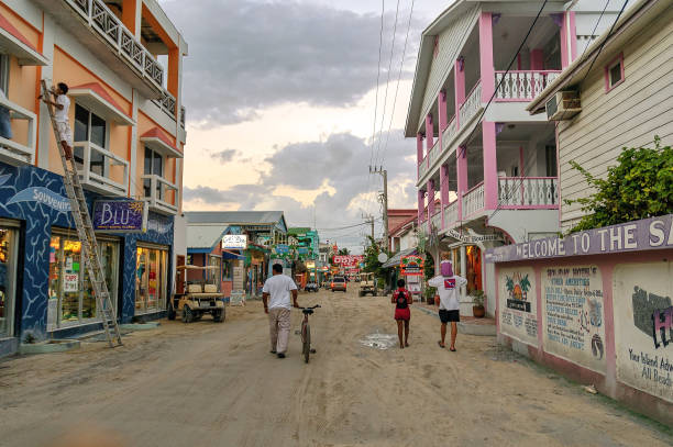 People walk in downtown San Pedro, Belize. stock photo