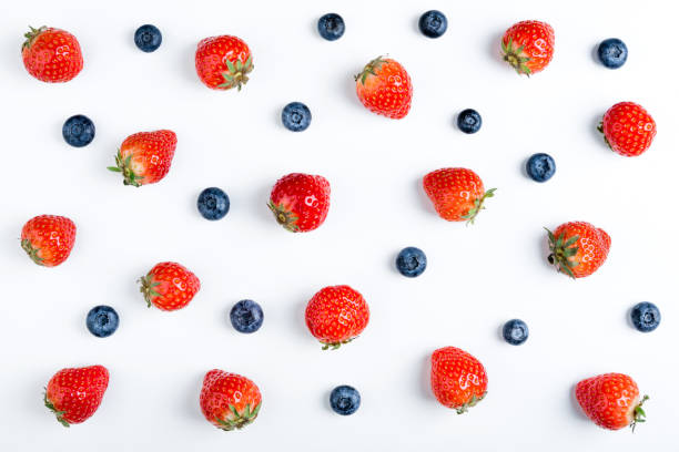 istock Strawberry and blueberry on white background, top view. Berries pattern, flat lay. Strawberry and blueberry isolated on white background. Creative food 972596738