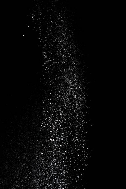 istock White powder splash isolated on black background. Flour sifting on a black background. Explosive powder white 972596952
