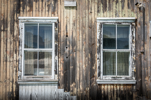 Old wooden windows with peeled paint