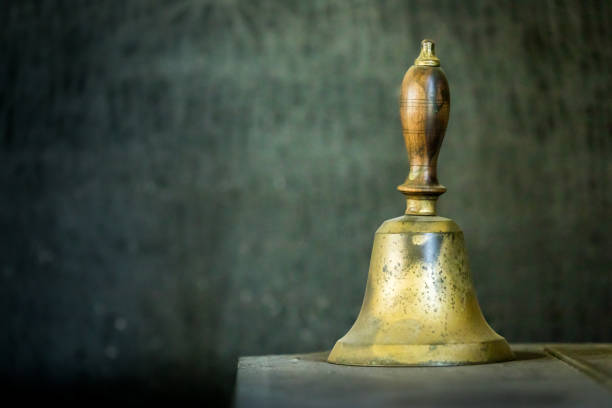 Vintage school bell Vintage school bell ringer stock pictures, royalty-free photos & images