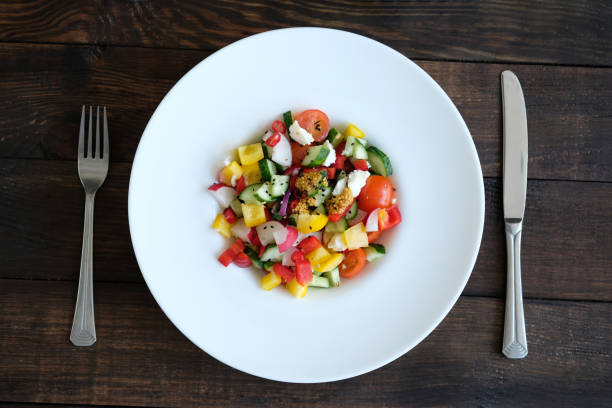 istock salad from vegetables on old wooden table 972609616