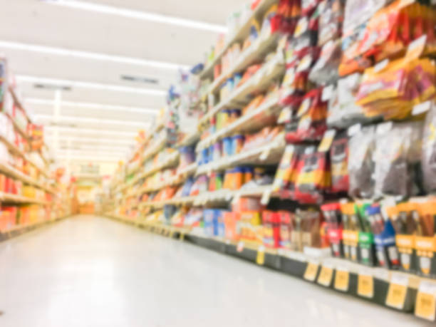 istock Abstract blurred candy, chips, cookies at grocery store in USA 972613028