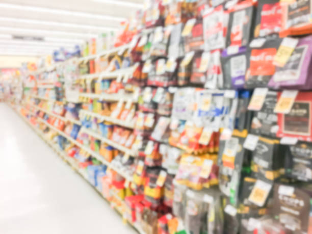 istock Abstract blurred candy, chips, cookies at grocery store in USA 972613422