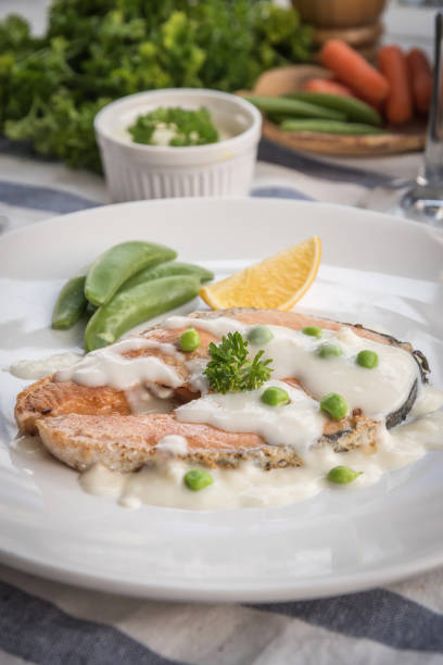 istock Grilled salmon steak with lemon and vegetables, 972617354