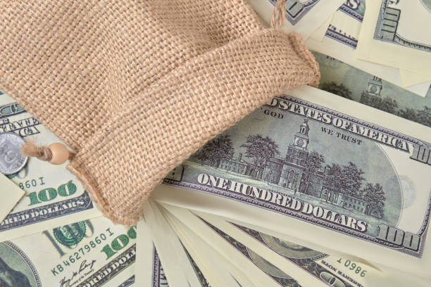 istock Woolean sack with money. 972618052