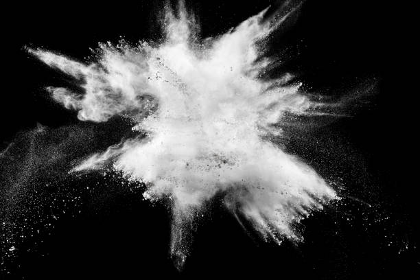istock Launched white powder splash on black background. Bizarre forms of of white powder explosion cloud against dark background. 972620936