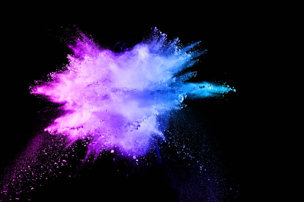 istock Multi color powder explosion isolated on black background. Colored dust splash cloud on black background. Launched colorful particles on background. Painted Holi. 972627022