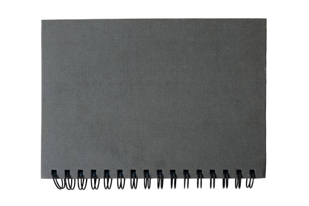 istock Top view of grey diary on white background 972627206