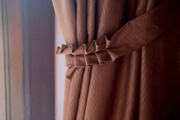 istock Brown curtain decoration on window in bedroom 972627724