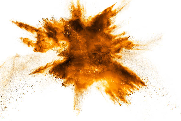 istock abstract orange dust explosion on white background. abstract orange powder splattered on white background, Freeze motion of orange powder splashing. 972646810