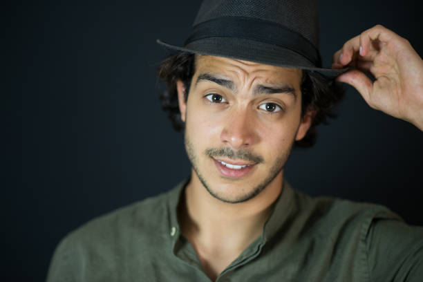 istock Close Up of Young Man With Hat 972649878