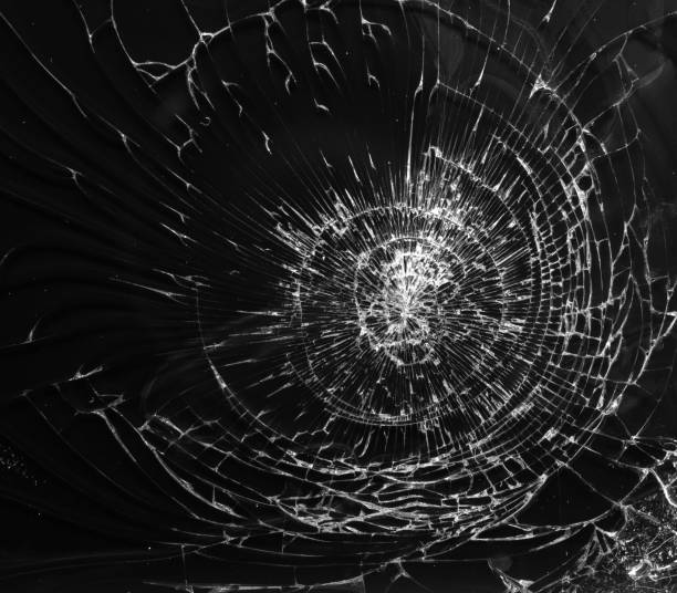 istock Cracked glass texture on black background 972655450