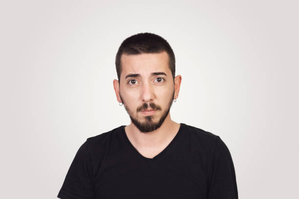 istock Handsome young adult with angry emotion 972658470