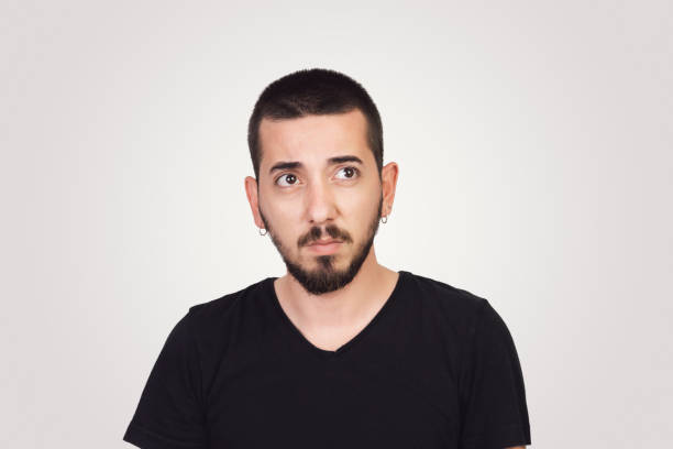 istock Handsome young adult with angry emotion 972658624