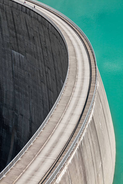 istock People walking on edge of Stausee Mooserboden Dam, Kaprun, Austria 972658734