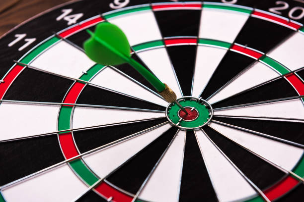 istock On the Target. Green dart hitting the target. 972658986