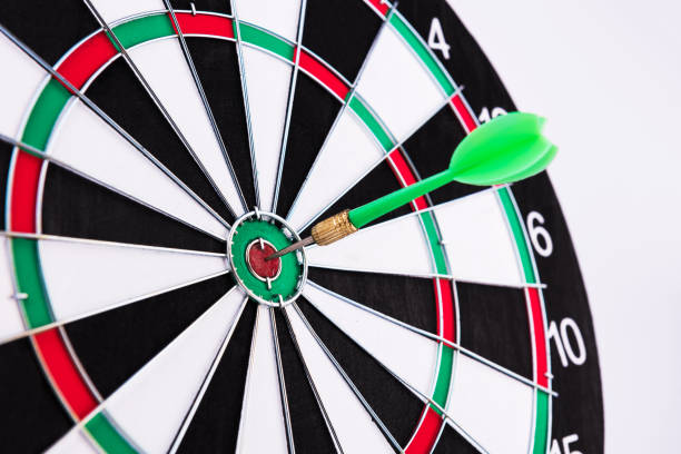 istock On the Target. Green dart hitting the target. 972659194