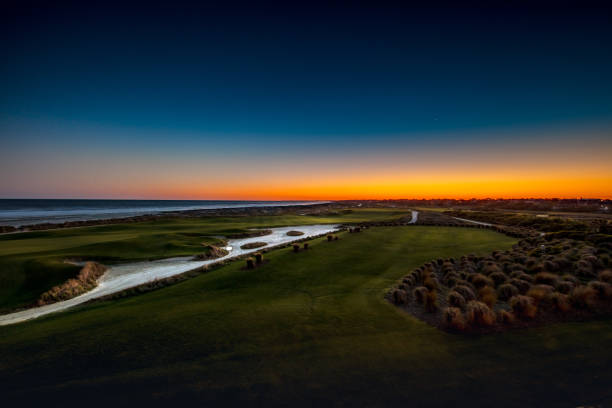 Kiawah Dunes Sunset from the deck of the Ryder Cup bar at Kiawah Island, South Carolina overlooking the 18th green kiawah island stock pictures, royalty-free photos & images