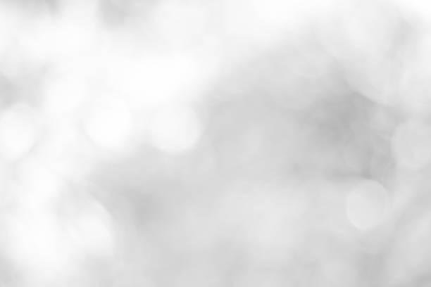 istock white blurred backdrop of nature, circle white wallpaper, gray bokeh background 972675686