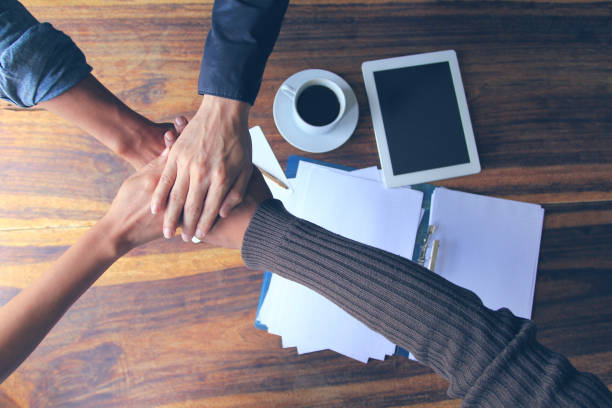 istock Meeting teamwork concept,Friendship,Group people with stack of hands showing unity after successful negotiations at office 972680436
