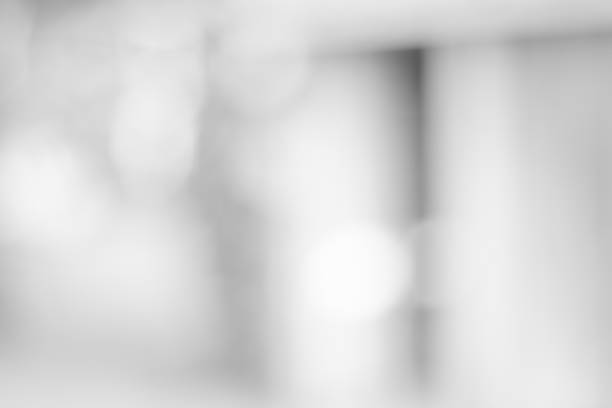 istock white blurred backdrop of nature, circle white wallpaper, gray bokeh background 972689278