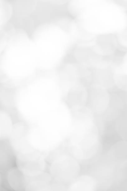 istock white blurred backdrop of nature, circle white wallpaper, gray bokeh background 972693920