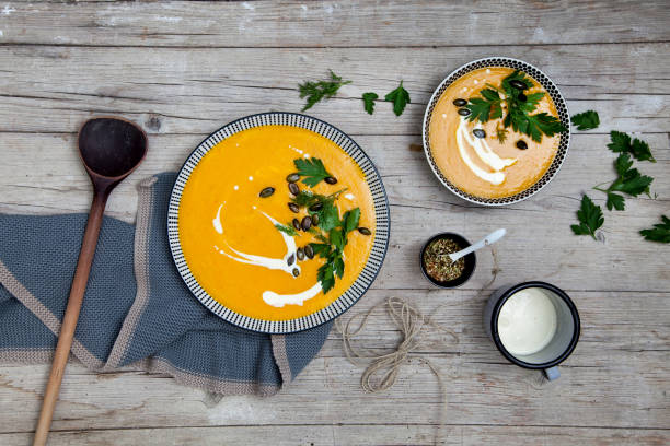 istock Directly Above Shot Of Pumpkin Soup On Table 972701318