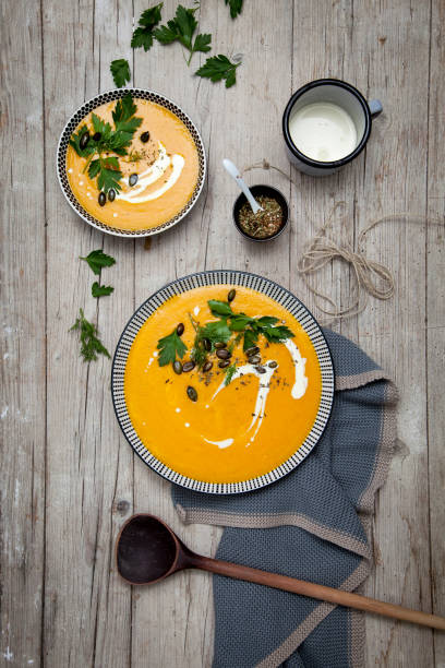 istock Directly Above Shot Of Pumpkin Soup On Table 972701364