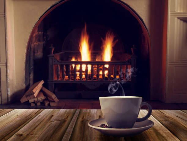 istock Close-Up Of Cup On Table Against Fireplace 972705326