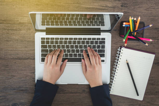 istock Business woman hands typing on laptop keyboard in office 972717680