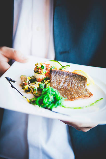 Midsection Of Man Holding Food