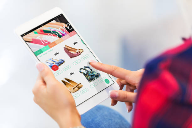 istock Young woman shopping online on tablet computer 972721782