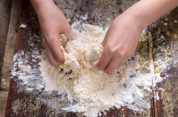 istock Close-Up Of Person Preparing Food 972723070