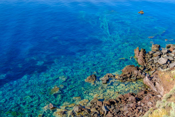 Clear waters of Filicudi, one of the islands of the Aeolian archipelago (Sicily, Italy) Clear waters of Filicudi, one of the islands of the Aeolian archipelago (Sicily, Italy) filicudi stock pictures, royalty-free photos & images