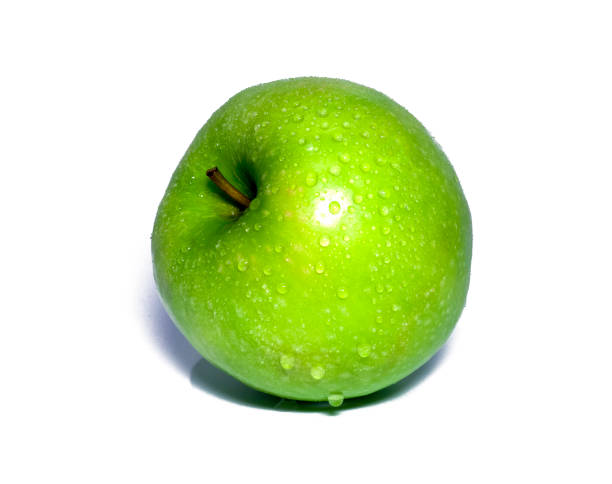 istock green apple with dew isolated on white. food, healthy 972723834