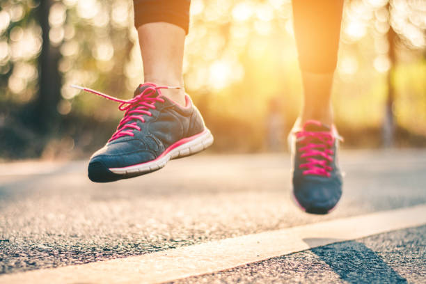 istock Low Section Of Woman Jumping Over Road 972723890