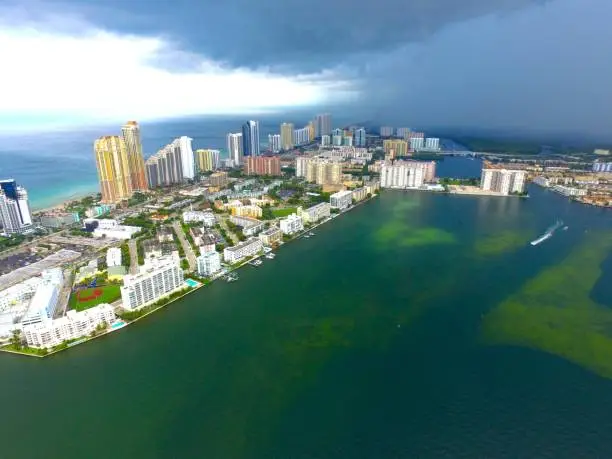 A beautiful shot from the air of the raw power of nature as in impending storm covering Miami Beach and everything that lays in its path.