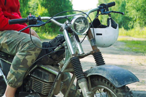 istock Middle section of enduro racer sitting on his motorcycle 972734012