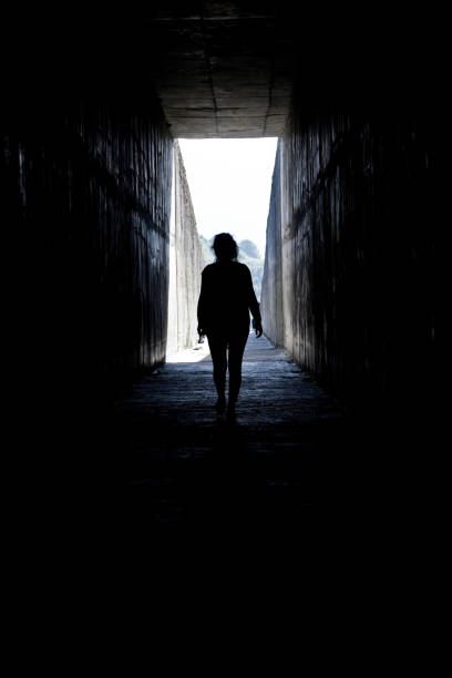 istock People are in a dark tunnel. 972742390
