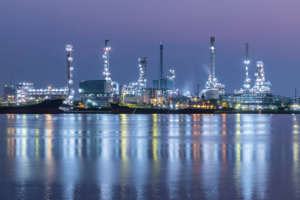 istock Oil refinery at twilight, Chao Phraya river, Thailand 972743214