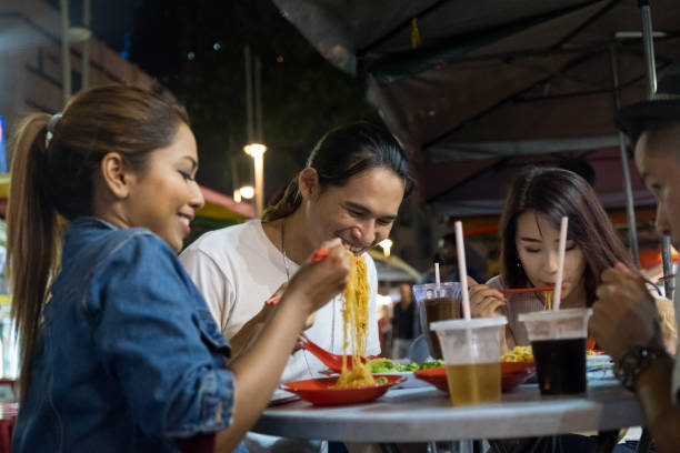 istock Friends eating together at the local market 972749582