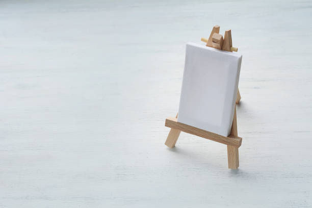 istock Close up view of blank canvas miniature with easel 972754478