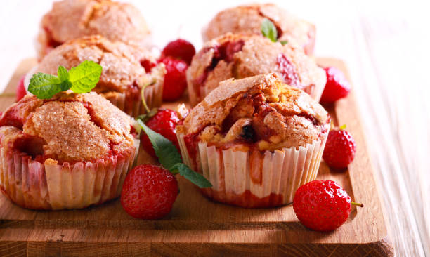istock Strawberry cakes on wooden cutting board 972760534