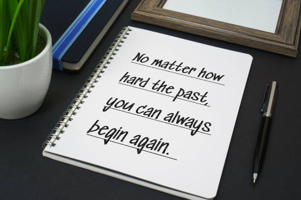istock Notebook with pen on black background with quote 972761322