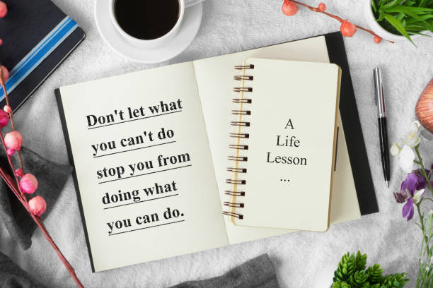 istock Notebook with pen on cozy white tablecloth with quote 972761324