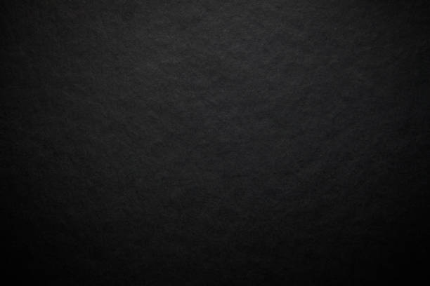 istock black paper texture or background with spotlight, dark tone 972763948