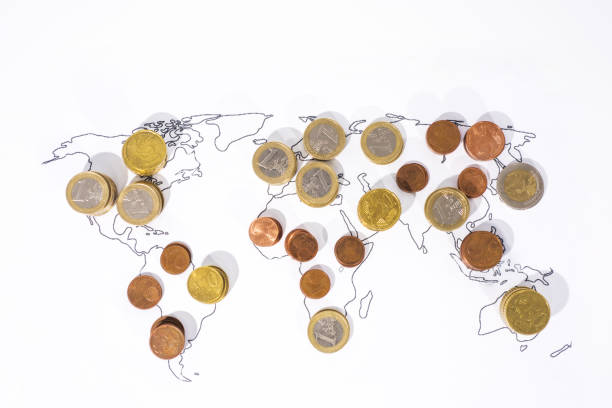 istock A lot of coins on World Map. 972763986