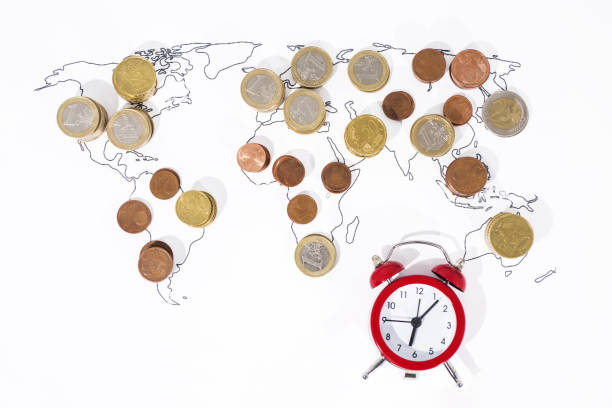 istock A lot of coins on World Map. 972763990